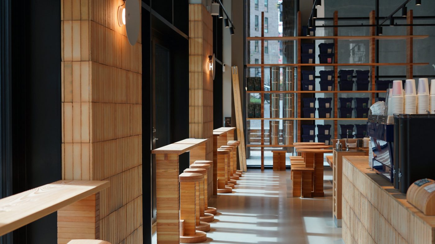 Interior of a SHOUT Media coffee shop with wooden bar and seating