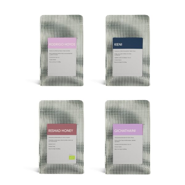 Four bags of coffee from the Taster Pack laid out in a grid